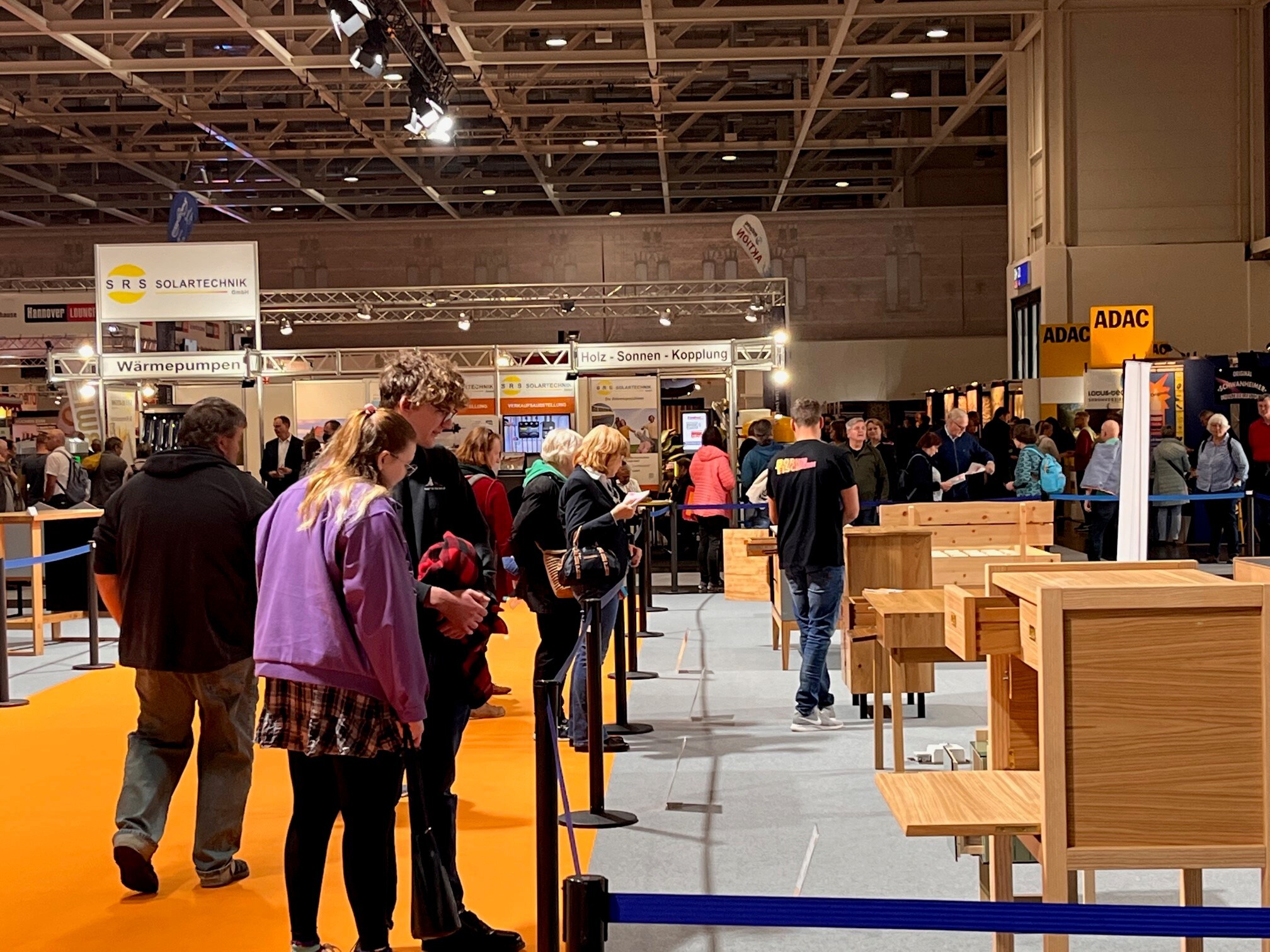 infa 2026, ‘Die Gute Form’ design competition, awards for outstanding journeyman’s pieces in the joinery trade, visitors viewing exhibits in an exhibition hall